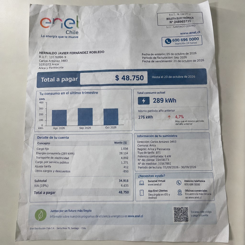 Create a statement, an electricity bill in CHILE. The A4 statement should be realistic, as if it were photographed on a phone. The document should be on a white background. The document must be for the last 3 months of October 2026. The document should contain several transactions and be wrinkled at the edges.
Name HERNALDO JAVIER FERNÁNDEZ ROBLEDO
Address Carlos Antúnez 3483, 1031072 Arica, Arica y Parinacota
R.U.T. 13176998-9
Date of birth 29.11.1976