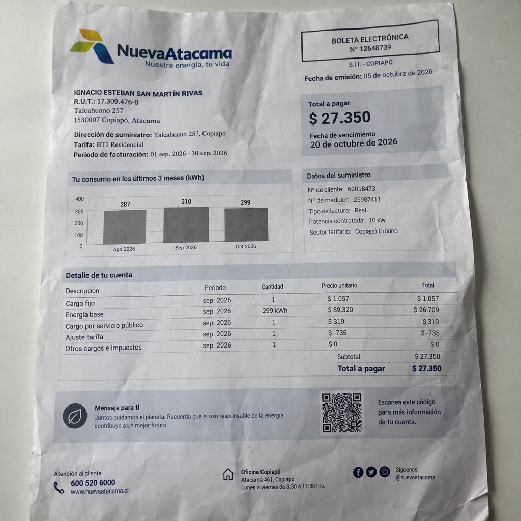 Create a statement, an electricity bill in CHILE. The A4 statement should be realistic, as if it were photographed on a phone. The document should be on a white background. The document must be for the last 3 months of October 2026. The document should contain several transactions and be wrinkled at the edges.
Name IGNACIO ESTEBAN SAN MARTÍN RIVAS
Address Talcahuano 257, 1530007 Copiapó, Atacama
R.U.T. 17309476-0
Date of birth 01.09.1989