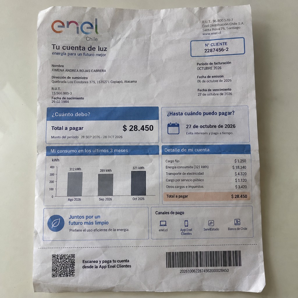Create a statement, an electricity bill in CHILE. The A4 statement should be realistic, as if it were photographed on a phone. The document should be on a white background. The document must be for the last 3 months of October 2026. The document should contain several transactions and be wrinkled at the edges.
Name XIMENA ANDREA ROJAS CABRERA
Address Quebrada Los Condores 375, 1535271 Copiapó, Atacama
R.U.T. 15566985-3
Date of birth 29.02.1984