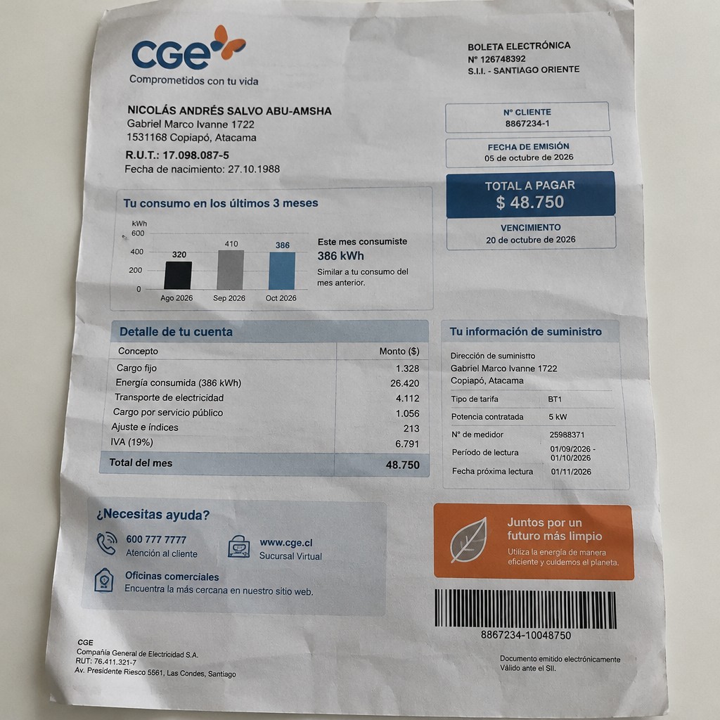 Create a statement, an electricity bill in CHILE. The A4 statement should be realistic, as if it were photographed on a phone. The document should be on a white background. The document must be for the last 3 months of October 2026. The document should contain several transactions and be wrinkled at the edges.
Name NICOLÁS ANDRÉS SALVO ABU-AMSHA
Address Gabriel Marco Ivanne 1722, 1531168 Copiapó, Atacama
R.U.T. 17098087-5
Date of birth 27.10.1988
