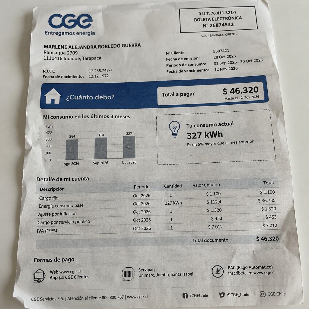 Create a statement, an electricity bill in CHILE. The A4 statement should be realistic, as if it were photographed on a phone. The document should be on a white background. The document must be for the last 3 months of October 2026. The document should contain several transactions and be wrinkled at the edges.
Name MARLENE ALEJANDRA ROBLEDO GUERRA
Address Rancagua 2709, 1110416 Iquique, Tarapacá
R.U.T. 12265747-7
Date of birth 12.12.1972