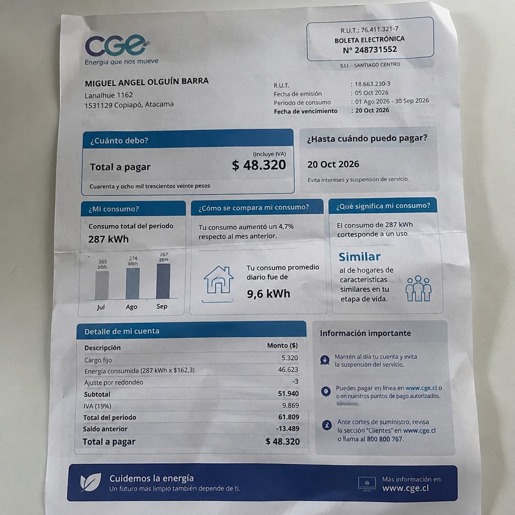 Create a statement, an electricity bill in CHILE. The A4 statement should be realistic, as if it were photographed on a phone. The document should be on a white background. The document must be for the last 3 months of October 2026. The document should contain several transactions and be wrinkled at the edges.
Name MIGUEL ANGEL OLGUÍN BARRA
Address Lanalhue 1162, 1531129 Copiapó, Atacama
R.U.T. 18663230-3
Date of birth 24.11.1993