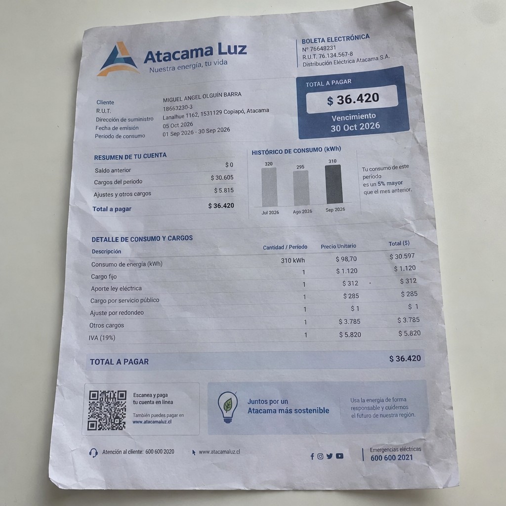 Create a statement, an electricity bill in CHILE. The A4 statement should be realistic, as if it were photographed on a phone. The document should be on a white background. The document must be for the last 3 months of October 2026. The document should contain several transactions and be wrinkled at the edges.
Name MIGUEL ANGEL OLGUÍN BARRA
Address Lanalhue 1162, 1531129 Copiapó, Atacama
R.U.T. 18663230-3
Date of birth 24.11.1993