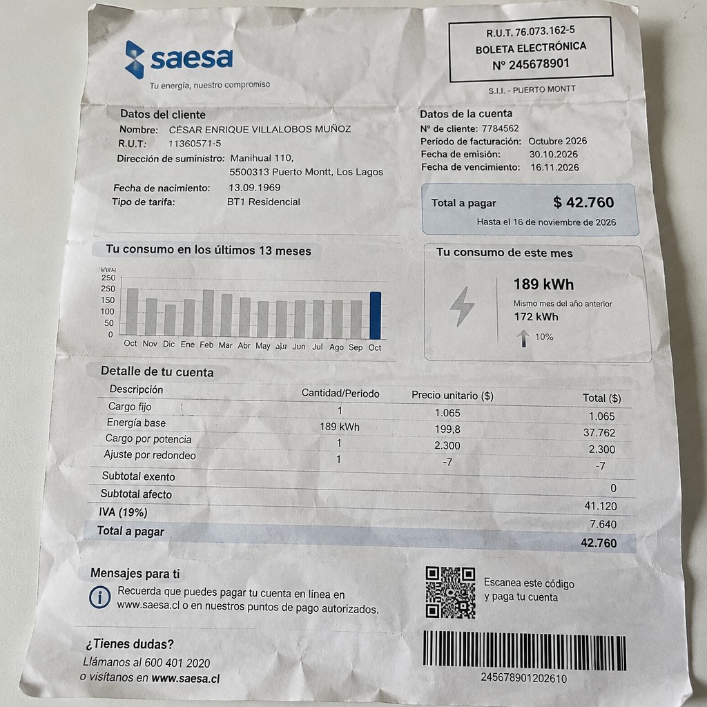 Create a statement, an electricity bill in CHILE. The A4 statement should be realistic, as if it were photographed on a phone. The document should be on a white background. The document must be for the last 3 months of October 2026. The document should contain several transactions and be wrinkled at the edges.
Name CÉSAR ENRIQUE VILLALOBOS MUÑOZ
Address Manihual 110, 5500313 Puerto Montt, Los Lagos
R.U.T. 11360571-5
Date of birth 13.09.1969
Date of discharge 30.10.2026 (OCTOBER 2026)