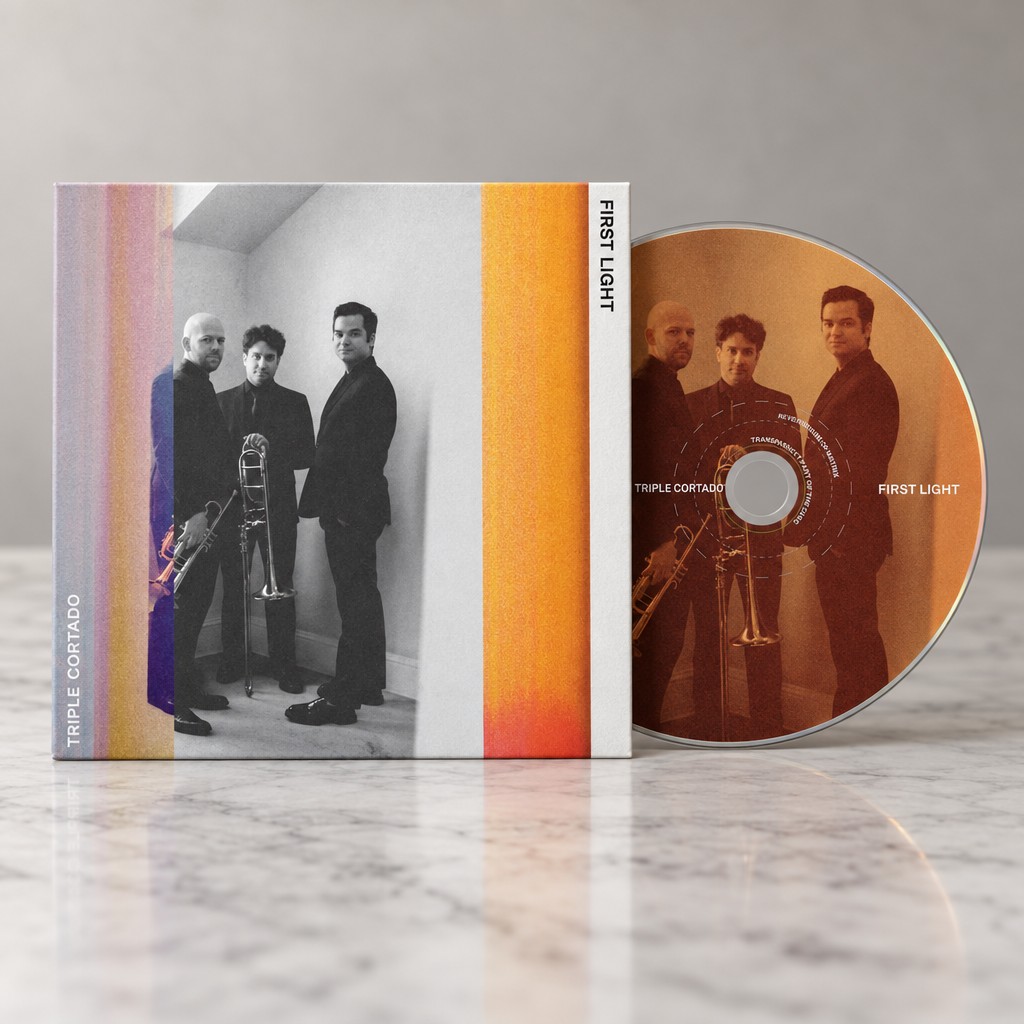 Create a photorealistic product mockup using the uploaded CD artwork exactly as provided. photo dimensions should be 1475 x 1052. The physical packaging should match the reference image: a simple square cardboard CD wallet/sleeve in the foreground, viewed straight-on, with the CD partially slid out from behind the sleeve on the right. Do not use a jewel case, plastic case, or digipak.
Place the CD wallet and partially exposed disc on a light, elegant white/gray marble tabletop. The marble should have subtle natural veining and a very soft, restrained reflection directly beneath the packaging and disc—not glossy or mirror-like.
Use soft, diffused studio lighting, a neutral warm-gray background, realistic contact shadows, and very subtle depth of field. Keep the composition clean, minimal, premium, and photographic.
Preserve the uploaded artwork exactly. Do not redesign, reinterpret, crop, distort, recolor, or replace any artwork, photographs, typography, or logos. The cover should remain square and flat-facing, and the disc artwork should remain circular and correctly aligned to the CD.
The final image should look like a professional music-industry product photograph of a physical cardboard CD wallet, not an illustration or CGI render. Straight-on camera angle, centered composition, realistic paper texture and thickness, realistic CD edge and sheen, subtle marble reflection.